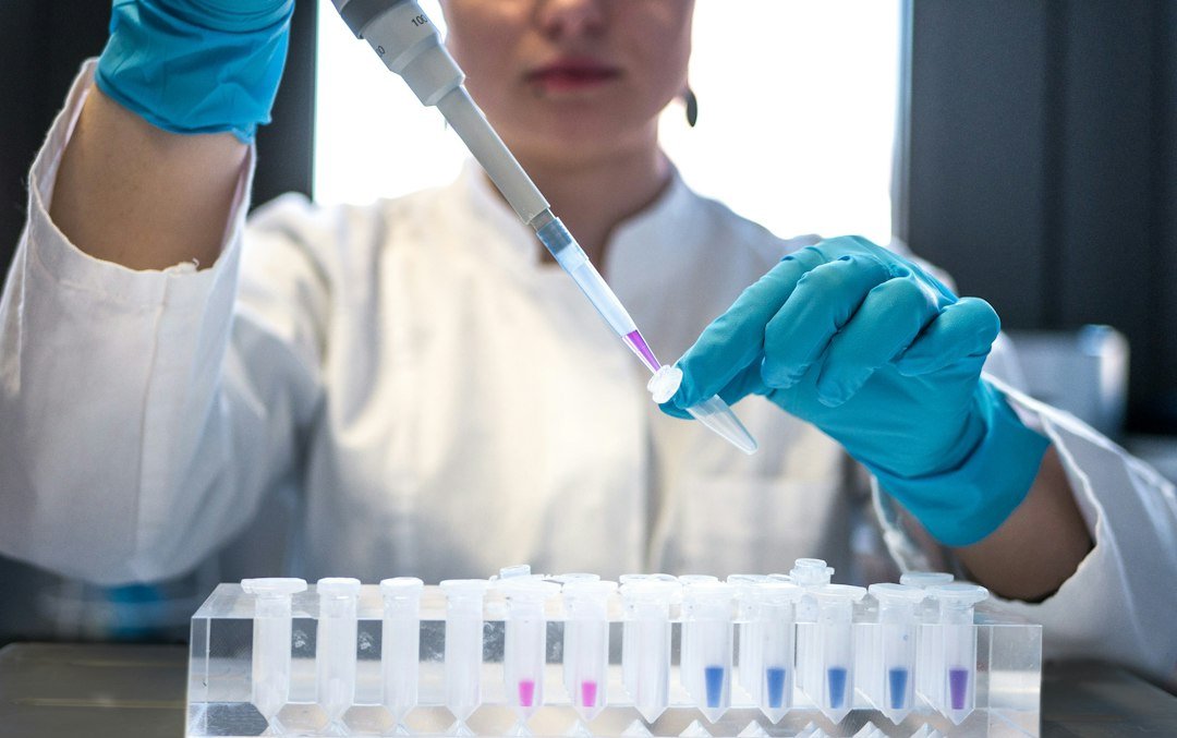 Scientist using a pipette in a laboratory